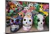 Mexico, Yucatan, Isla Mujeres, colorful ceramic calavera skulls for sale in market.-Merrill Images-Mounted Photographic Print