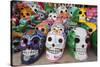 Mexico, Yucatan, Isla Mujeres, colorful ceramic calavera skulls for sale in market.-Merrill Images-Stretched Canvas