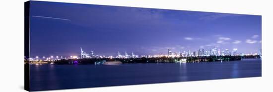 Miami, Florida: a Panoramic of Downtown and the Port of Miami Lit Up at Night-Brad Beck-Stretched Canvas