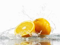 Oranges with Splashing Water-Michael L?ffler-Photographic Print