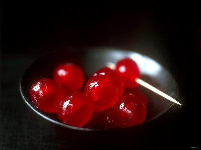 Cocktail Cherries in a Black Bowl