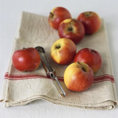 Fresh Apples on Linen Cloth with Peeler