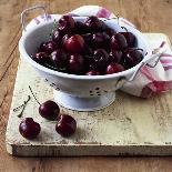 Red Cherries in a Colander on an Old Wooden Chopping Board-Michael Paul-Photographic Print