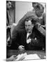 Michael V. Di Salle Puffing His Cigar while at His Desk-Hank Walker-Mounted Photographic Print