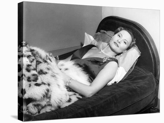 Michèle Morgan Laid on a Bed, 1951-Marcel Begoin-Stretched Canvas
