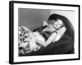 Michèle Morgan Laid on a Bed, 1951-Marcel Begoin-Framed Photographic Print