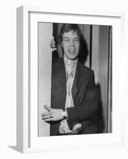 Mick Jagger in a Door-Associated Newspapers-Framed Photo
