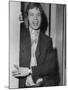 Mick Jagger in a Door-Associated Newspapers-Mounted Photo