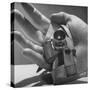 Micro Camera Resting in Palm of Hand-Andreas Feininger-Stretched Canvas