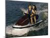 Mid Adult Couple Riding a Jet Ski-null-Mounted Premium Photographic Print