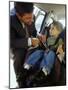 Mid Adult Man Strapping His Son into a Car-null-Mounted Photographic Print