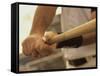 Mid Section View of a Baseball Player Swinging a Baseball Bat-null-Framed Stretched Canvas