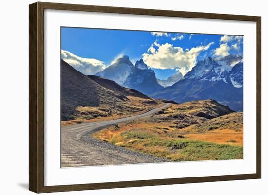 Midday Landscape in the National Park Torres Del Paine; Chile. the Gravel Road is Bent between Yell-kavram-Framed Photographic Print