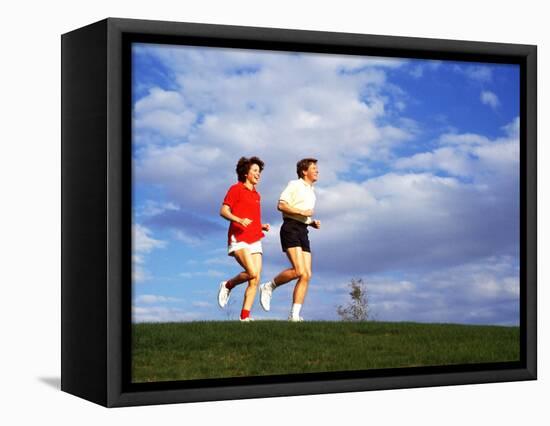 Middle-Aged Couple Jogging Together-Bill Bachmann-Framed Stretched Canvas