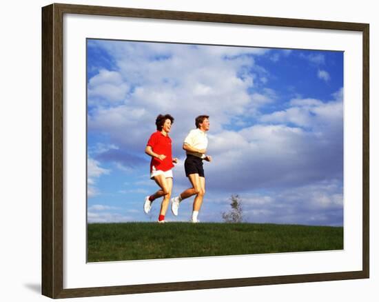 Middle-Aged Couple Jogging Together-Bill Bachmann-Framed Photographic Print