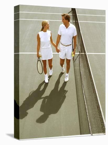 Middle-Aged Couple Relaxing after Tennis Match-Bill Bachmann-Stretched Canvas