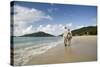 Middle Aged Couple Walking on Lambert Beach, Tortola, British Virgin Islands-Macduff Everton-Stretched Canvas