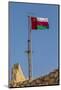 Middle East, Arabian Peninsula, Oman, Muscat, Muttrah. Omani flag flying in Muttrah.-Emily Wilson-Mounted Photographic Print