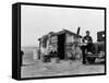 Migrant Father Cradling His Baby Outside Shanty-Dorothea Lange-Framed Stretched Canvas