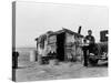 Migrant Father Cradling His Baby Outside Shanty-Dorothea Lange-Stretched Canvas