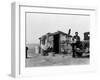 Migrant Father Cradling His Baby Outside Shanty-Dorothea Lange-Framed Photographic Print