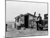 Migrant Father Cradling His Baby Outside Shanty-Dorothea Lange-Mounted Photographic Print