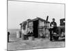 Migrant Father Cradling His Baby Outside Shanty-Dorothea Lange-Mounted Photographic Print