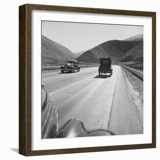 Migrants' Old Car Travels on the Three Lane Highway in California, 1939-null-Framed Photo