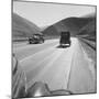Migrants' Old Car Travels on the Three Lane Highway in California, 1939-null-Mounted Photo