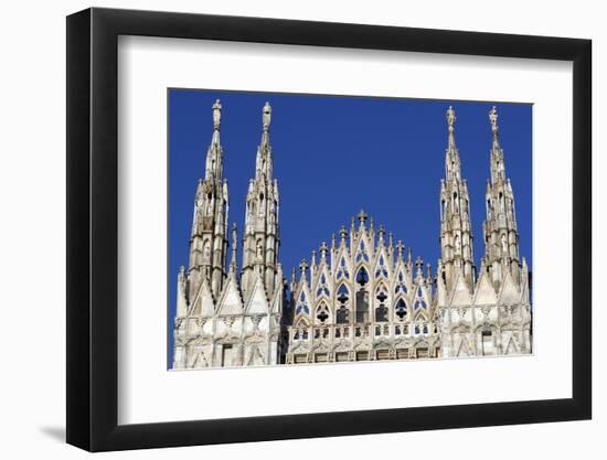 Milan Cathedral. The west facade of the Duomo. The Gothic style cathedral is dedicated to St Mary-Godong-Framed Photographic Print