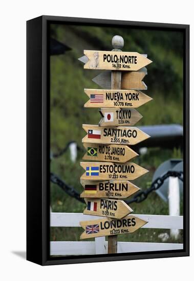 Mileage Sign Pointing Directions in Puerto Williams-Paul Souders-Framed Stretched Canvas