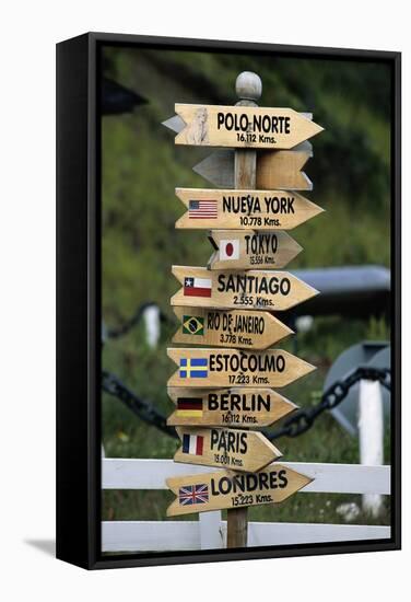 Mileage Sign Pointing Directions in Puerto Williams-Paul Souders-Framed Stretched Canvas