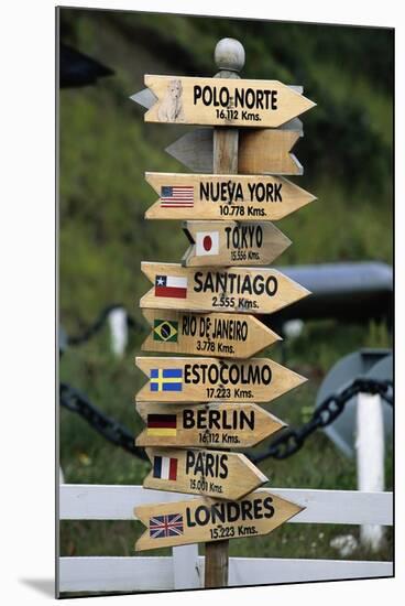 Mileage Sign Pointing Directions in Puerto Williams-Paul Souders-Mounted Photographic Print