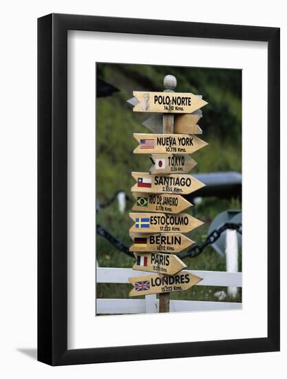 Mileage Sign Pointing Directions in Puerto Williams-Paul Souders-Framed Photographic Print