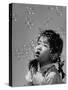 Mili's High Speed Camera Catches Little Girl Watching Shower of Soap Bubble Drifting Down on Her-Gjon Mili-Stretched Canvas