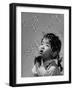 Mili's High Speed Camera Catches Little Girl Watching Shower of Soap Bubble Drifting Down on Her-Gjon Mili-Framed Photographic Print