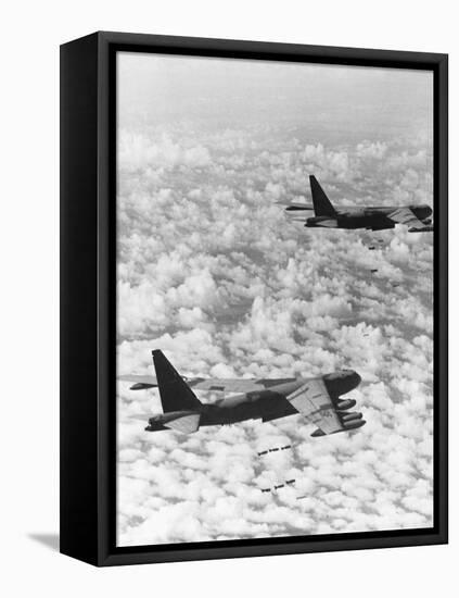 Military Airplane Dropping Bombs in Vietnam-null-Framed Stretched Canvas