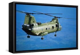 Military Helicopter Flying in Blue Skies-null-Framed Stretched Canvas