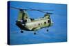 Military Helicopter Flying in Blue Skies-null-Stretched Canvas