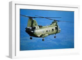 Military Helicopter Flying in Blue Skies-null-Framed Photographic Print