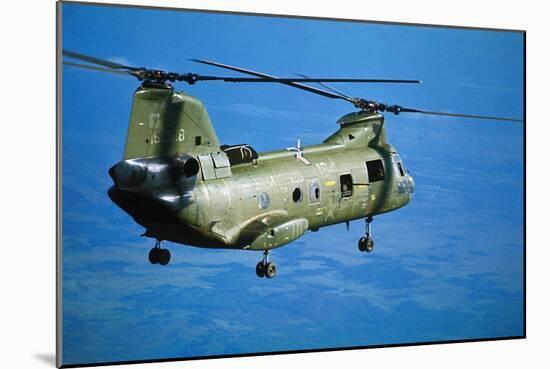 Military Helicopter Flying in Blue Skies-null-Mounted Photographic Print