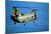 Military Helicopter Flying in Blue Skies-null-Mounted Photographic Print