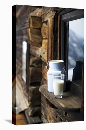 Milk Can and Glass of Milk on Window Sill of Alpine Chalet-Sabine Mader-Stretched Canvas