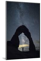Milky Way and person under Delicate Arch, Arches National Park, Moab, Grand County, Utah, United St-Francesco Vaninetti-Mounted Photographic Print