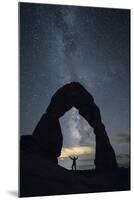 Milky Way and person under Delicate Arch, Arches National Park, Moab, Grand County, Utah, United St-Francesco Vaninetti-Mounted Photographic Print