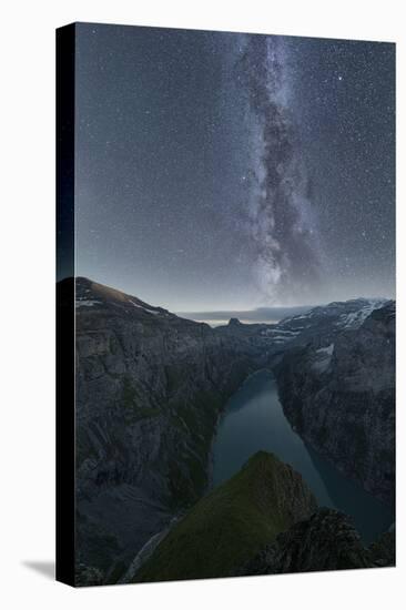 Milky Way in the starry night sky over lake Limmernsee, aerial view, Canton of Glarus, Switzerland-Roberto Moiola-Stretched Canvas