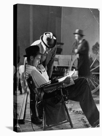 Millionaire Howard Hughes/Movie Studio Owner Studying Script on the Movie Set for "The Outlaw"-Bob Landry-Stretched Canvas