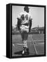 Milwaukee Braves Hank Aaron Leaning on Bat During Baseball Game-George Silk-Framed Stretched Canvas