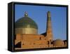 Minaret and Tiled Dome of a Mosque Rise Above the Old City of Khiva-Antonia Tozer-Framed Stretched Canvas