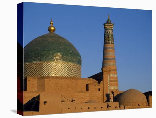 Minaret and Tiled Dome of a Mosque Rise Above the Old City of Khiva-Antonia Tozer-Stretched Canvas